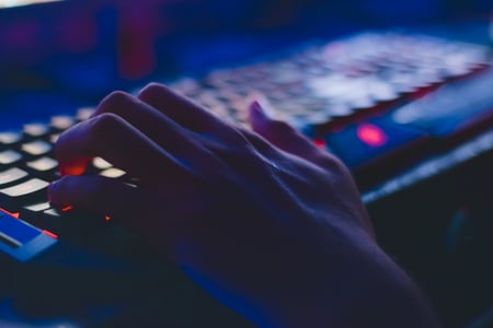 Hand typing on computer keyboard
