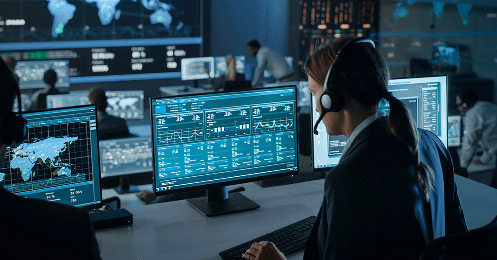 Female Software Engineer looking at dashboard showing security-related checks, in an office managing network security monitoring.