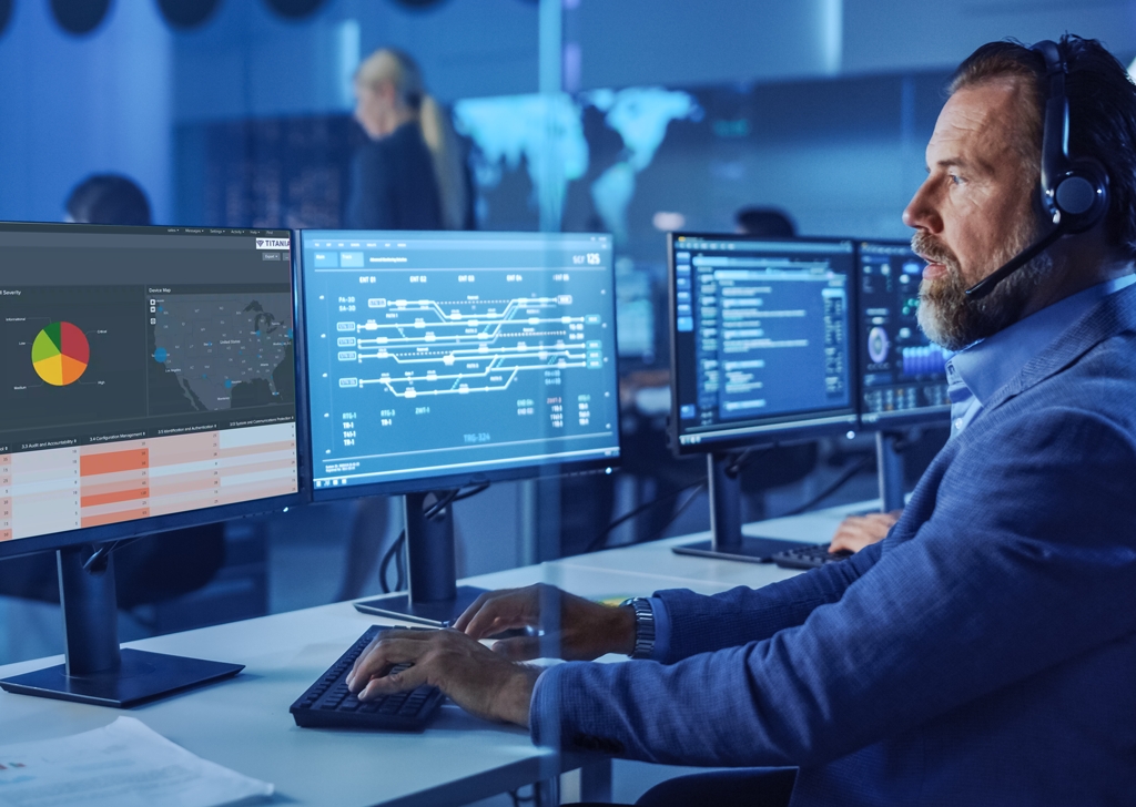 Cyber security professional speaking on headset and monitoring network security