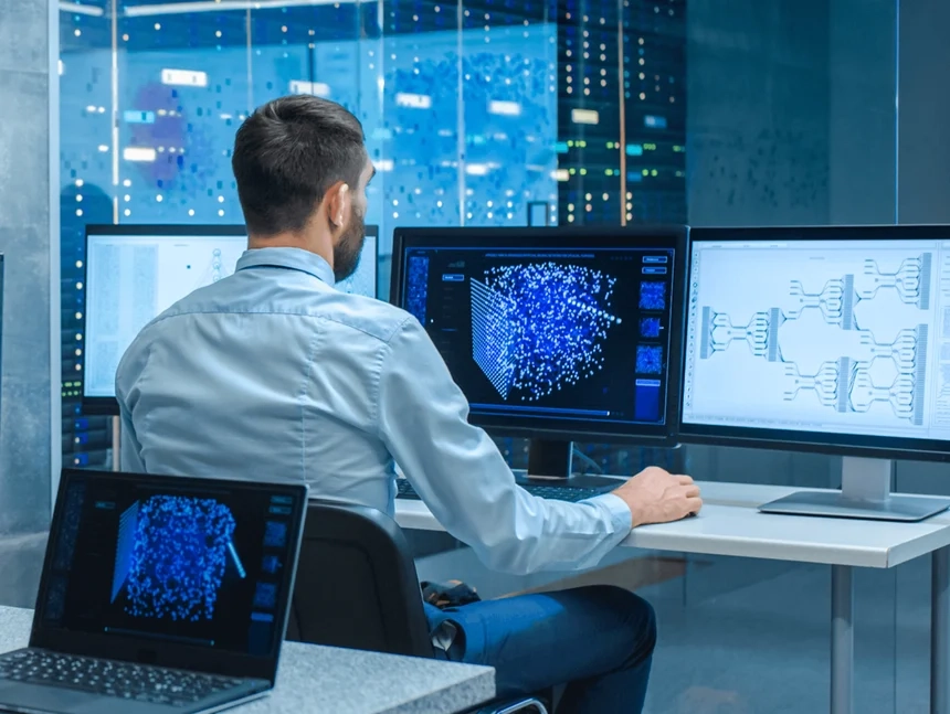 Male cyber security professional looking at network segmentation in work flow on computer.