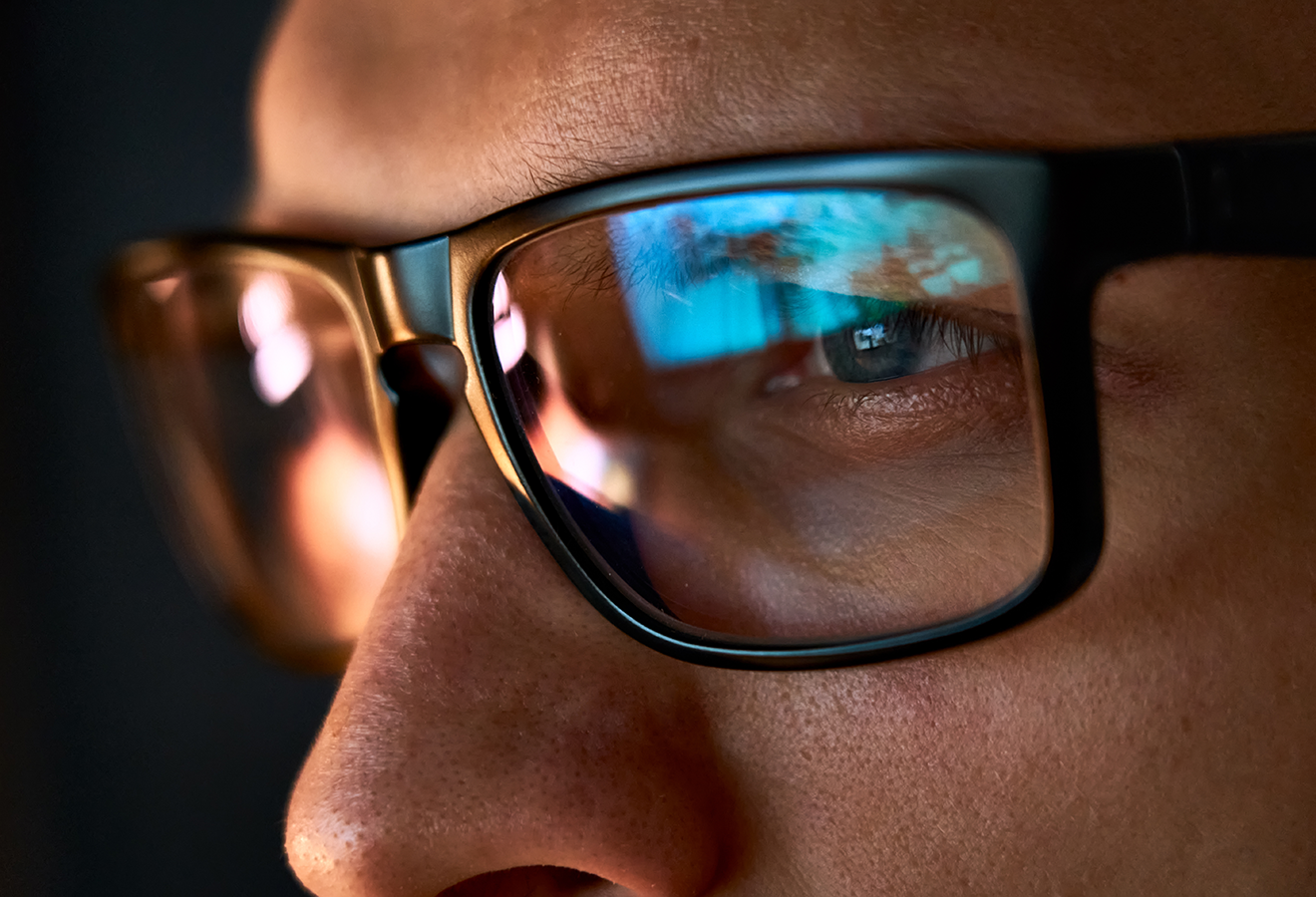 man-with-glasses-reflecting-screen